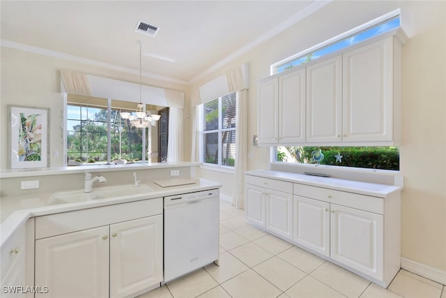 kitchen featuring white dishwasher, white cabinets, sink, hanging light fixtures, and a chandelier