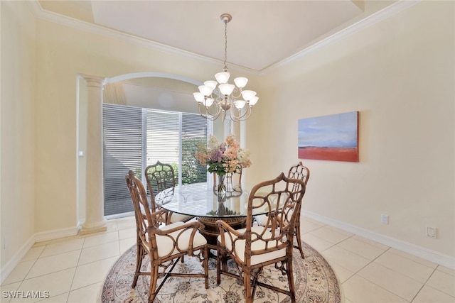 dining area with decorative columns, light tile patterned floors, ornamental molding, and an inviting chandelier