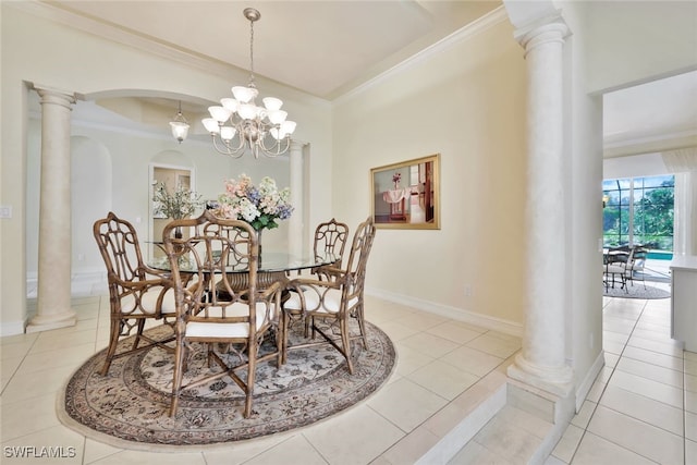 dining room featuring ornate columns, an inviting chandelier, ornamental molding, and light tile patterned flooring