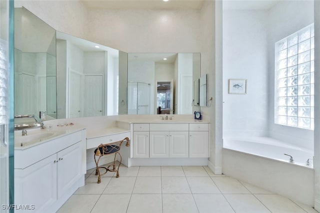 bathroom featuring vanity, tile patterned floors, and plenty of natural light