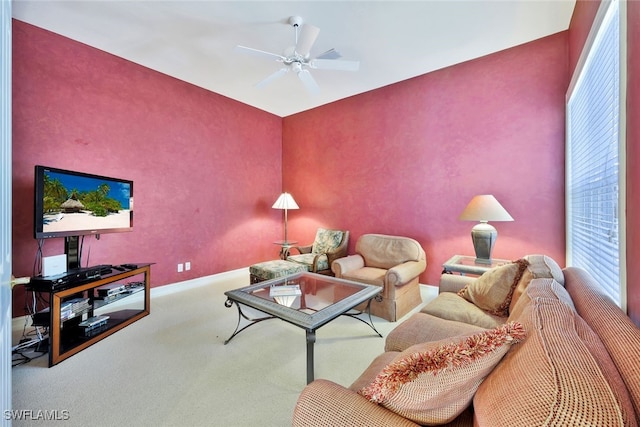 carpeted living room featuring ceiling fan