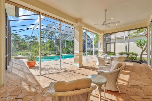 sunroom with a pool, plenty of natural light, and ceiling fan