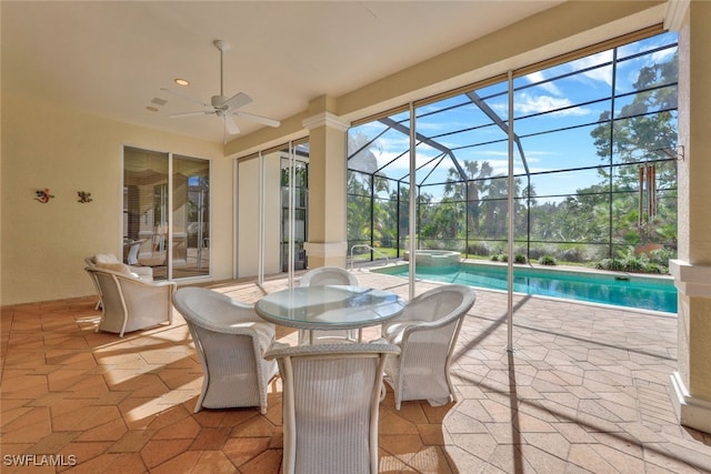 view of patio with ceiling fan and a lanai