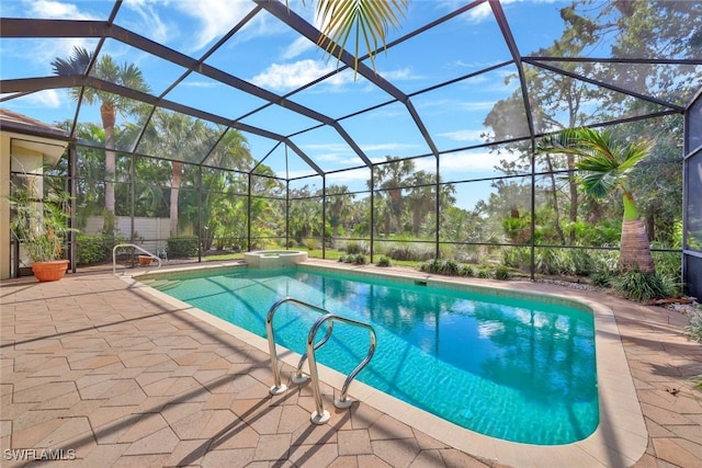 view of swimming pool featuring a lanai, a patio area, and an in ground hot tub