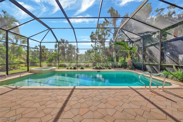 view of pool with glass enclosure, an in ground hot tub, and a patio area