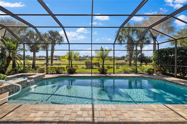 view of swimming pool featuring a lanai and an in ground hot tub