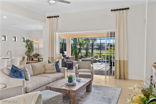 tiled living room featuring ceiling fan with notable chandelier and ornamental molding