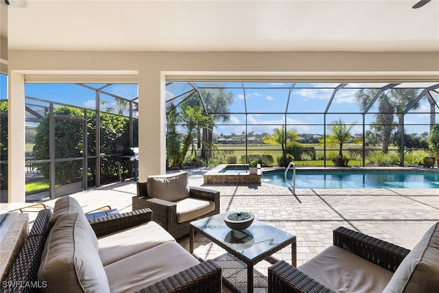 view of pool featuring glass enclosure, an outdoor hangout area, an in ground hot tub, and a patio