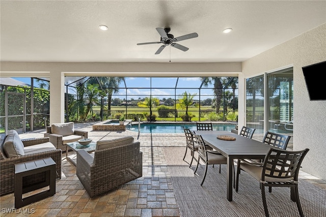 interior space with outdoor lounge area, ceiling fan, and a lanai