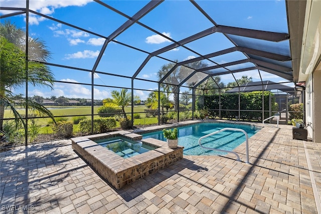 view of swimming pool with glass enclosure, an in ground hot tub, and a patio area