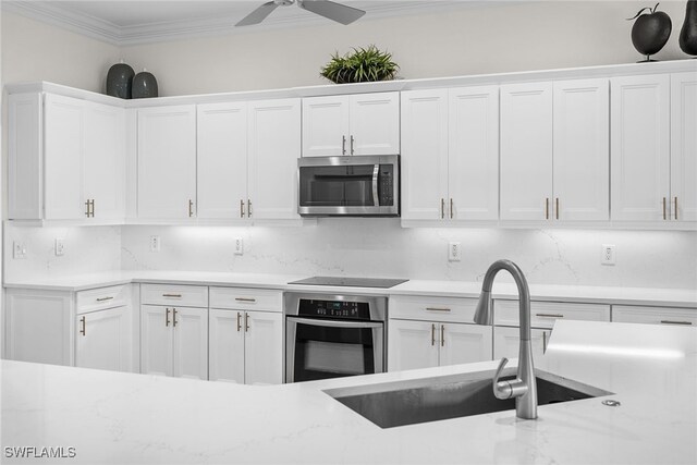 kitchen with white cabinets, sink, and stainless steel appliances