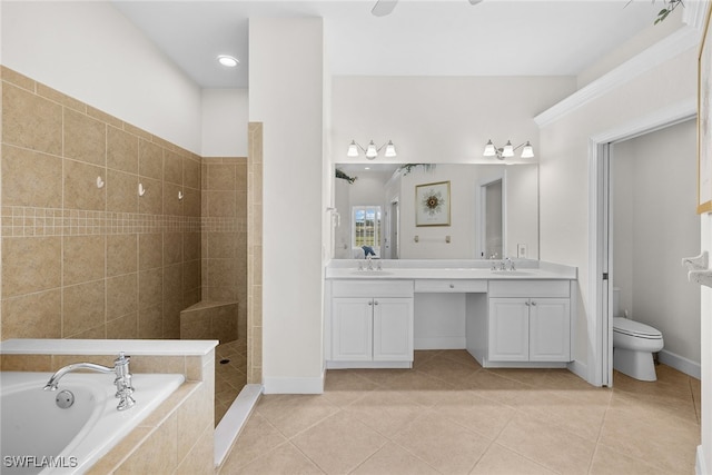 full bathroom featuring tile patterned flooring, toilet, vanity, and shower with separate bathtub