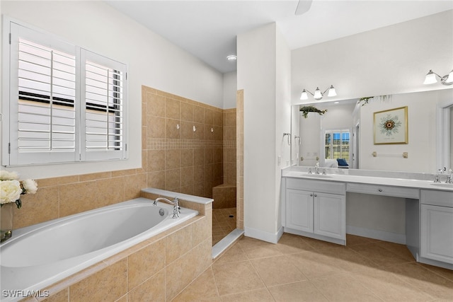 bathroom with tile patterned floors, separate shower and tub, and vanity