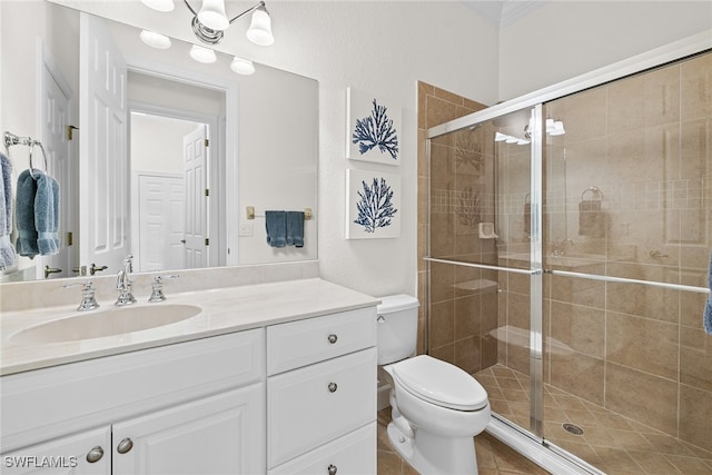 bathroom with tile patterned floors, vanity, toilet, and an enclosed shower