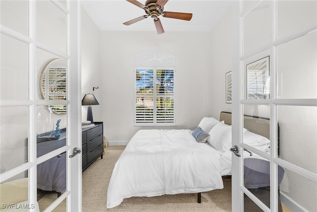 bedroom with carpet, ceiling fan, and crown molding