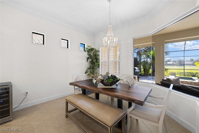 dining area featuring an inviting chandelier, beverage cooler, ornamental molding, and light tile patterned flooring