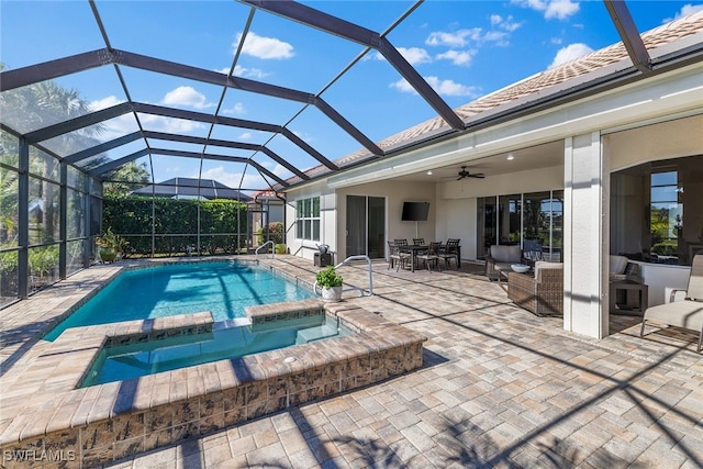 view of swimming pool with an outdoor hangout area, ceiling fan, a lanai, an in ground hot tub, and a patio area