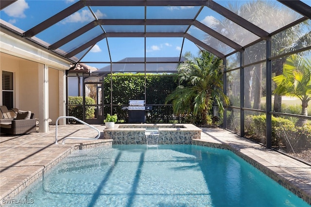 view of swimming pool featuring a lanai, a patio area, a jacuzzi, and pool water feature