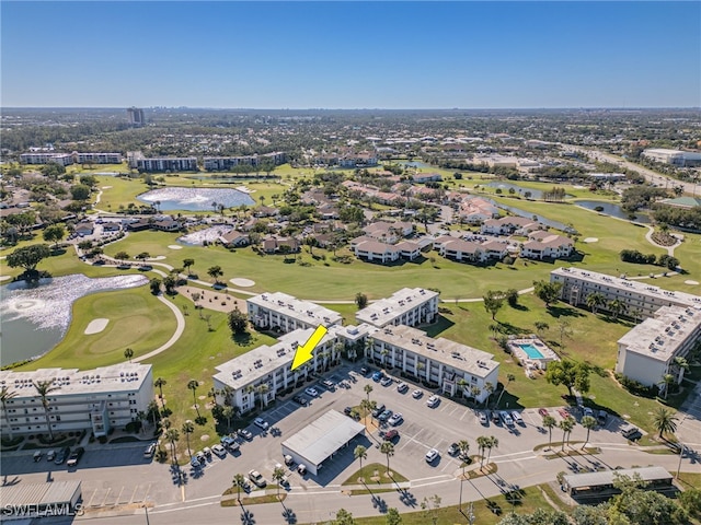 aerial view featuring view of golf course and a water view