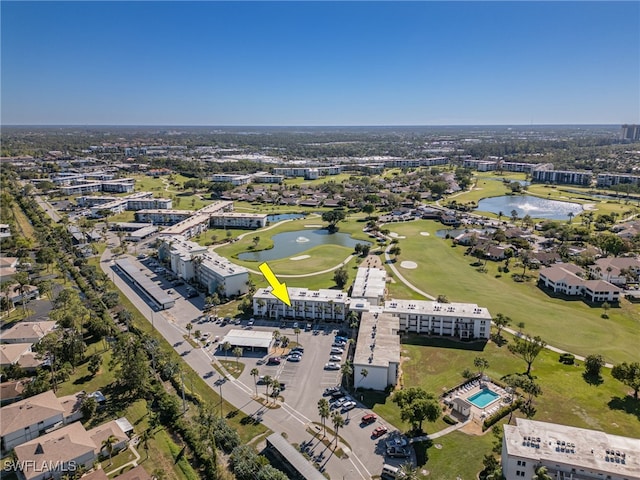 aerial view featuring view of golf course and a water view