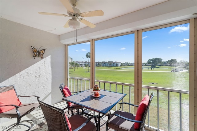 sunroom with a ceiling fan