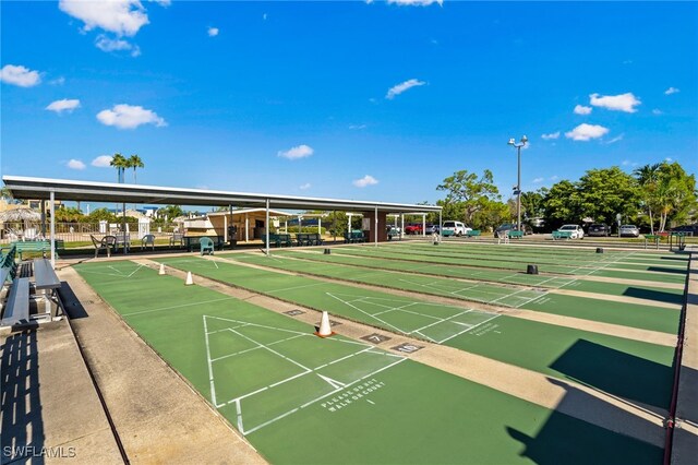 view of home's community featuring shuffleboard