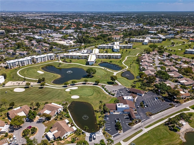 bird's eye view featuring view of golf course, a water view, and a residential view