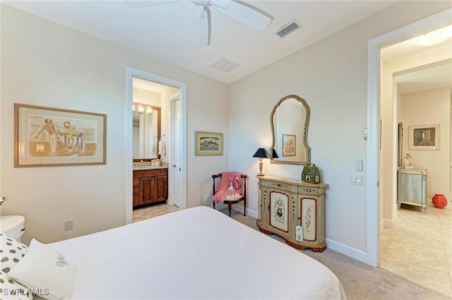 carpeted bedroom with connected bathroom and ceiling fan