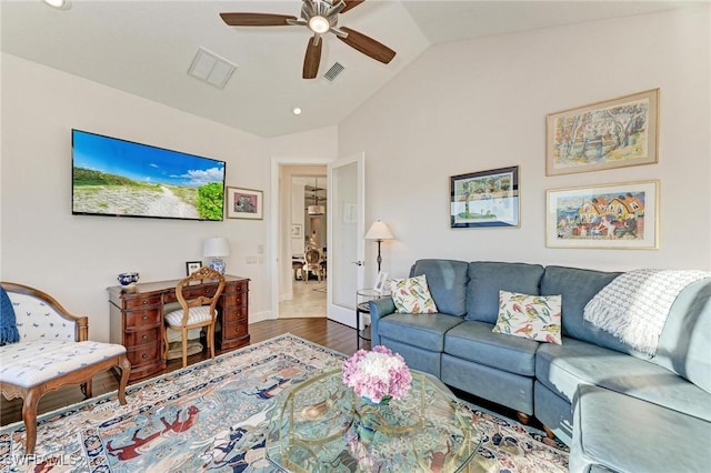 living room featuring hardwood / wood-style flooring, lofted ceiling, and ceiling fan