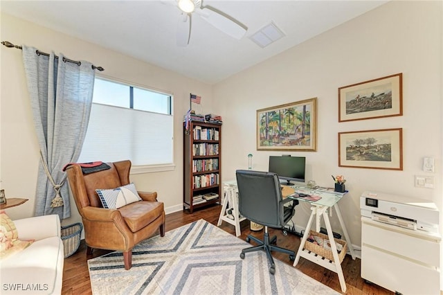 office space featuring dark hardwood / wood-style flooring and ceiling fan