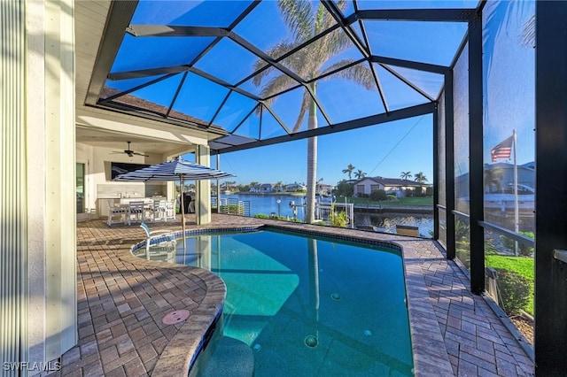 view of pool featuring a lanai, ceiling fan, and a patio area