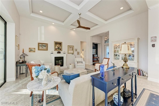 living room with a high ceiling, coffered ceiling, and beam ceiling