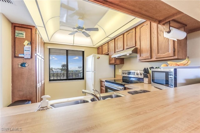 kitchen with stainless steel appliances, ceiling fan, and sink