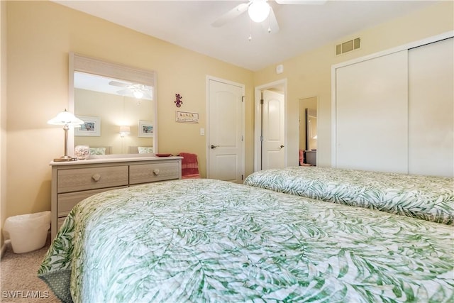 carpeted bedroom featuring ceiling fan