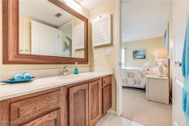 bathroom featuring tile patterned flooring and vanity