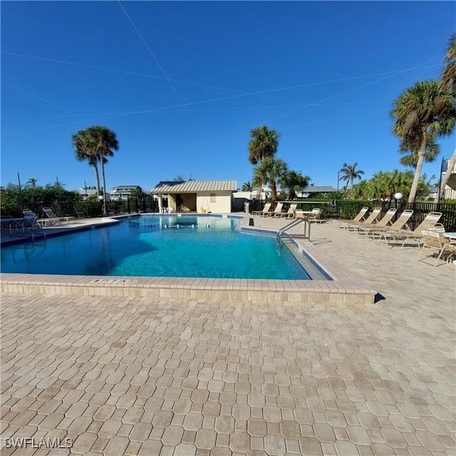 view of swimming pool with a patio area