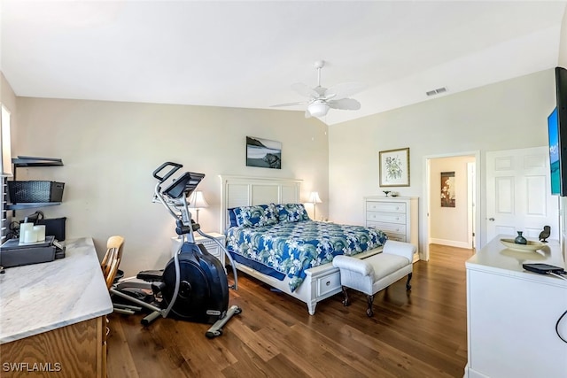 bedroom with ceiling fan, dark wood-type flooring, and vaulted ceiling