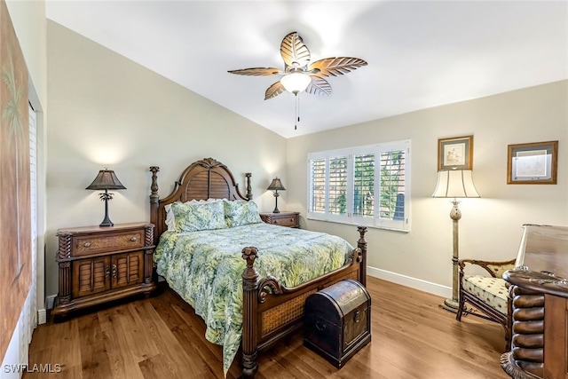 bedroom with hardwood / wood-style floors and ceiling fan