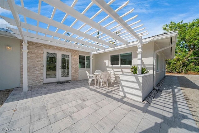 view of patio featuring a pergola and french doors