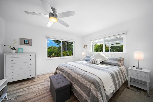 bedroom featuring hardwood / wood-style flooring and ceiling fan