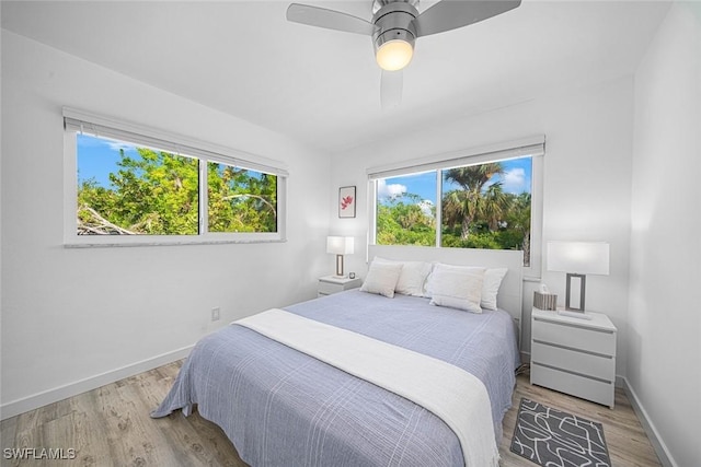 bedroom featuring light hardwood / wood-style flooring and ceiling fan