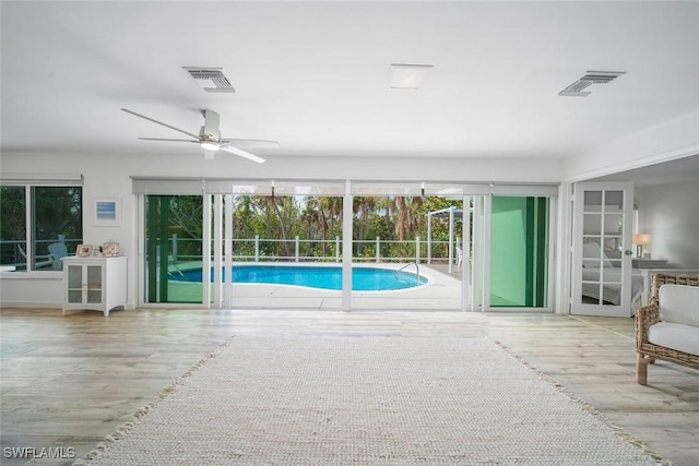 view of swimming pool with ceiling fan