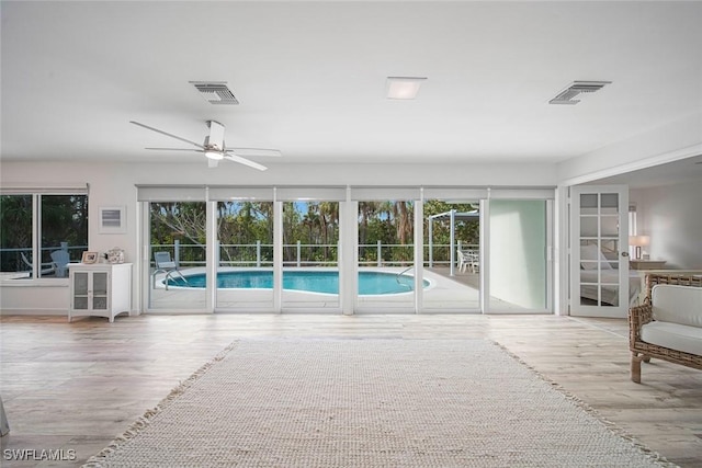 view of pool with ceiling fan