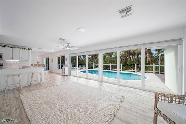 view of pool with ceiling fan