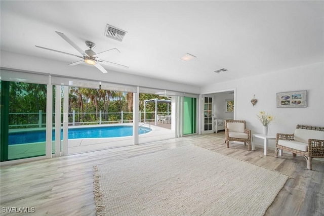 view of pool with ceiling fan