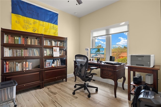 office area with ceiling fan and light hardwood / wood-style floors