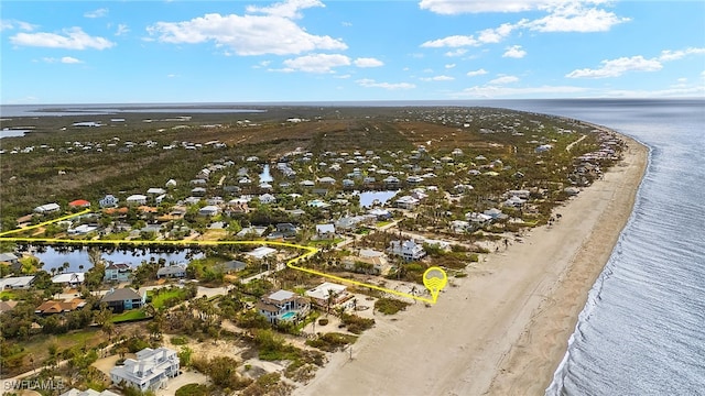 bird's eye view with a view of the beach and a water view