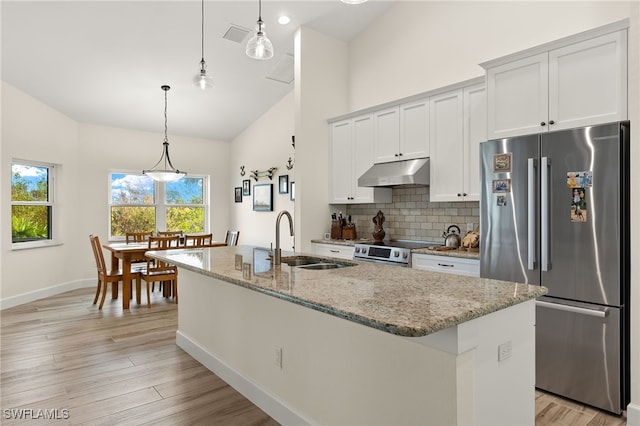 kitchen with light stone counters, white cabinetry, a kitchen island with sink, and appliances with stainless steel finishes