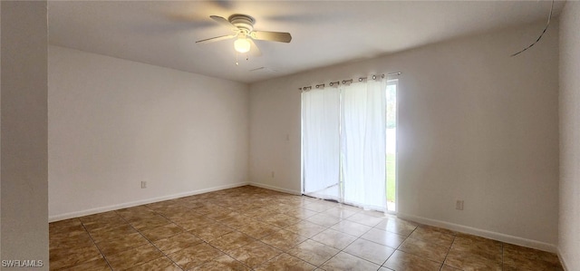 spare room featuring ceiling fan and tile patterned flooring