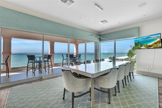 dining area with plenty of natural light and wood-type flooring